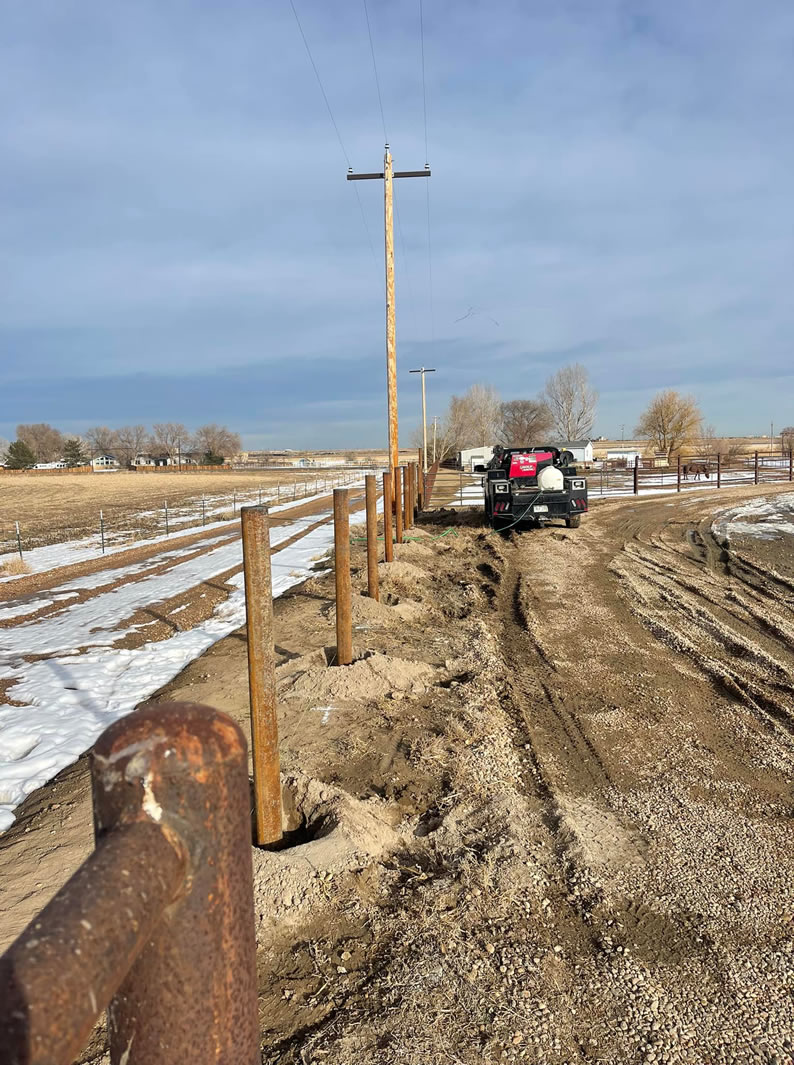 Adding onto an existing metal "Ponderosa" Style Pipe Property Fence. Construction by Integrity Welding Service LLC, servicing the Front Range of Colorado.
